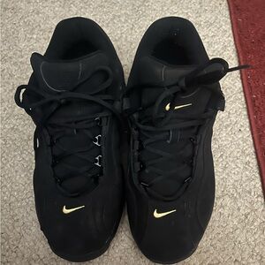 Men’s size 11 Nike sneakers, black with gold swish